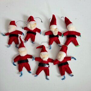 Set of 7 vintage handmade(?) felt Santas Christmas tree ornament decoration.